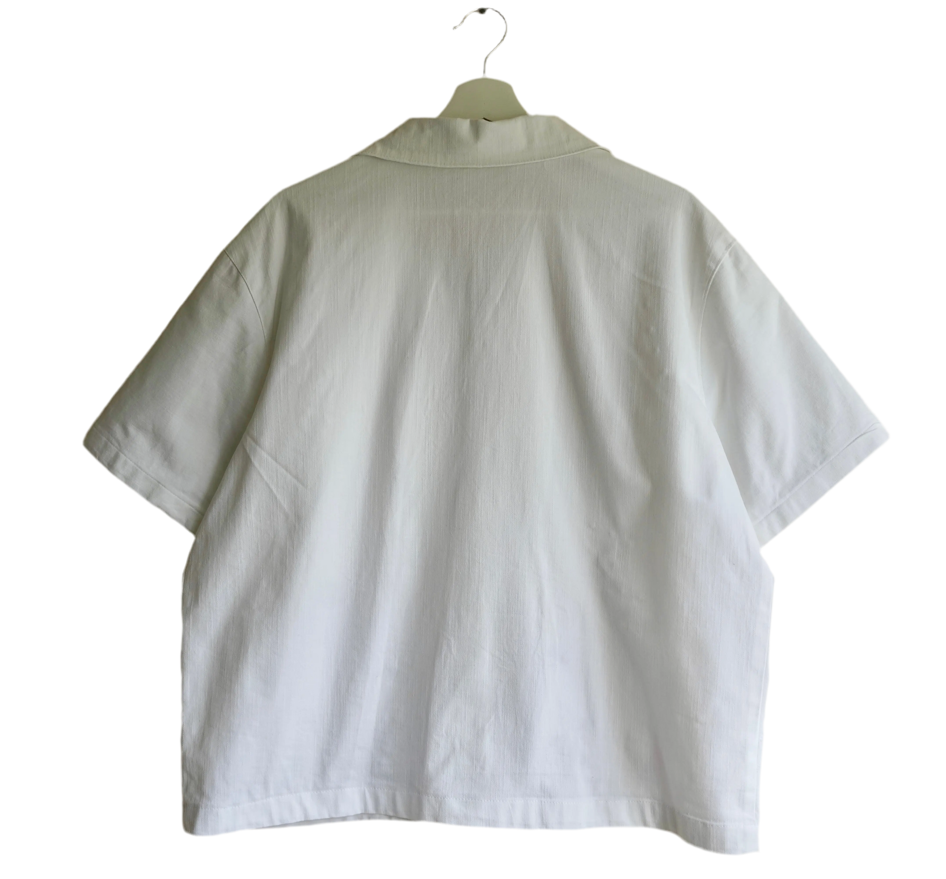 Handmade shirt button up, with flower embroidery from a sustainable fashion brand. Made from recycled materials.