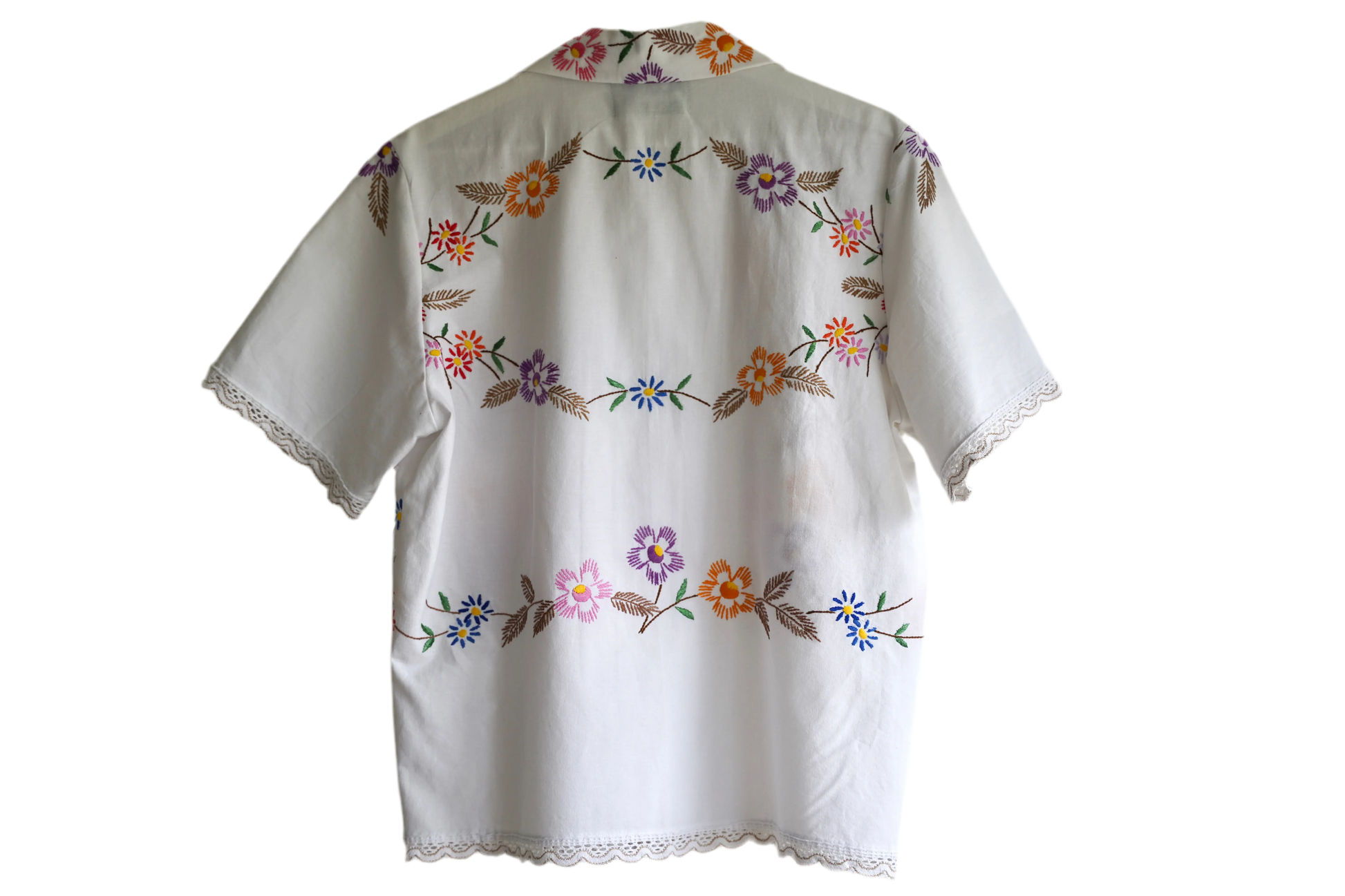 Handmade shirt button up, with flower embroidery from a sustainable fashion brand. Made from recycled materials. 