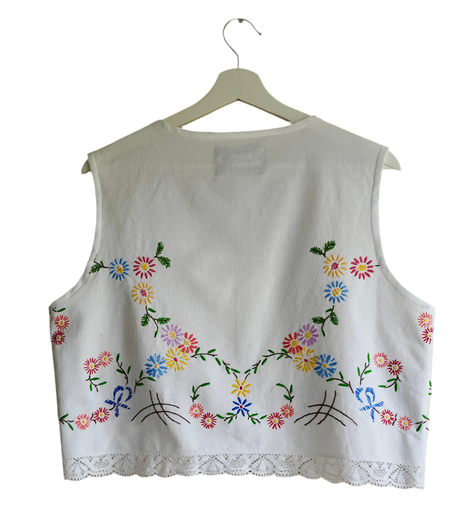 Handmade vest, with flower embroidery from a sustainable fashion brand. Made from recycled materials.