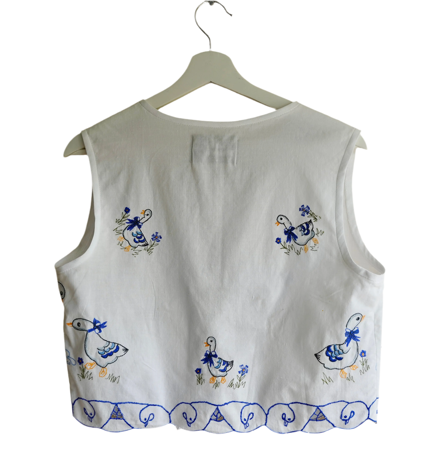 Handmade vest, with duck embroidery from a sustainable fashion brand. Made from recycled tablecloth materials.