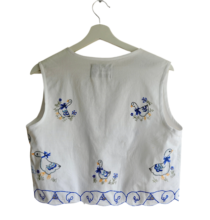 Handmade vest, with duck embroidery from a sustainable fashion brand. Made from recycled tablecloth materials.