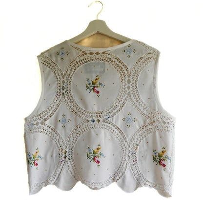 Handmade vest, with flower embroidery from a sustainable fashion brand. Made from recycled materials.