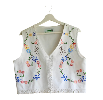 Handmade vest, with flower embroidery from a sustainable fashion brand. Made from recycled materials.